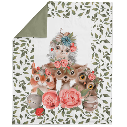 Fabric panel featuring cute baby animals with floral patterns and owl eyes, on a green background.