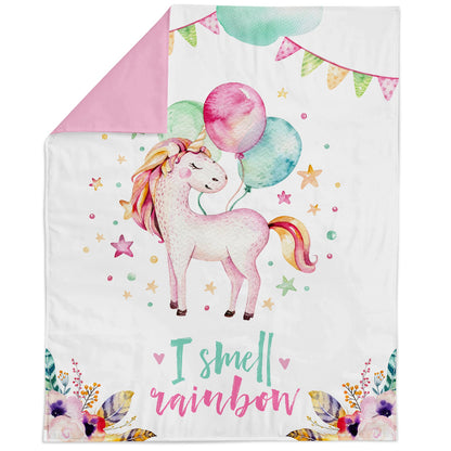 Fabric panel with a unicorn and balloon design, surrounded by colorful stars and flowers, with the text 'I smell a rainbow' at the bottom.