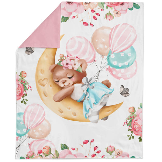 A fabric panel featuring a cute baby bear with a floral and balloon design, intended for quilting and sewing into bed linens or blankets.