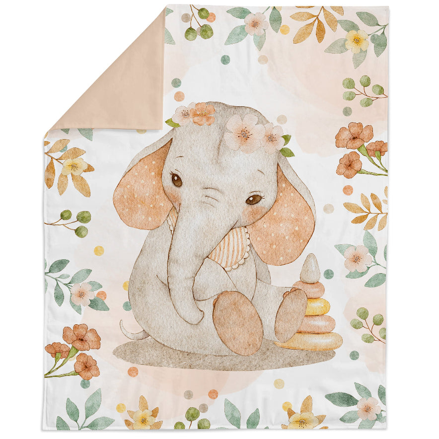 A fabric panel featuring a cute baby elephant with a floral pattern in pink and green tones.