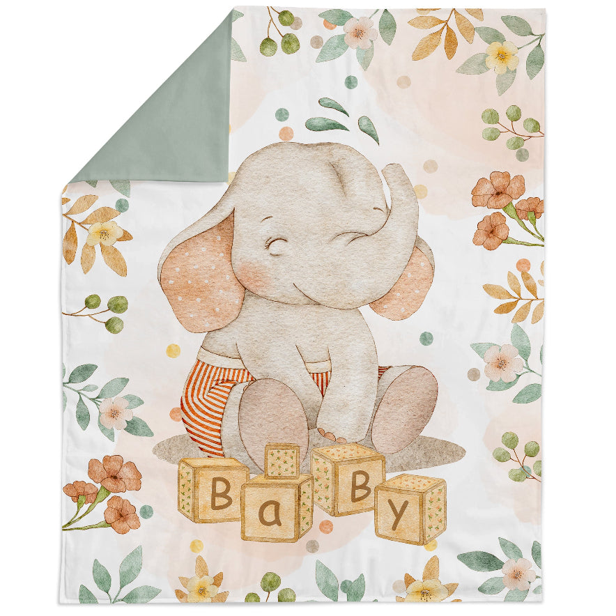 Baby blanket featuring a cute baby elephant design with floral elements and the text 'BABY' on a quilted background.