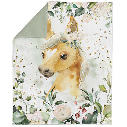 Cotton blanket with a horse illustration surrounded by flowers and leaves on a light green background