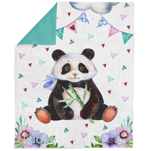A fabric panel featuring a colorful panda design with bamboo, surrounded by various patterns including triangles and flowers, intended for quilting and crafts.