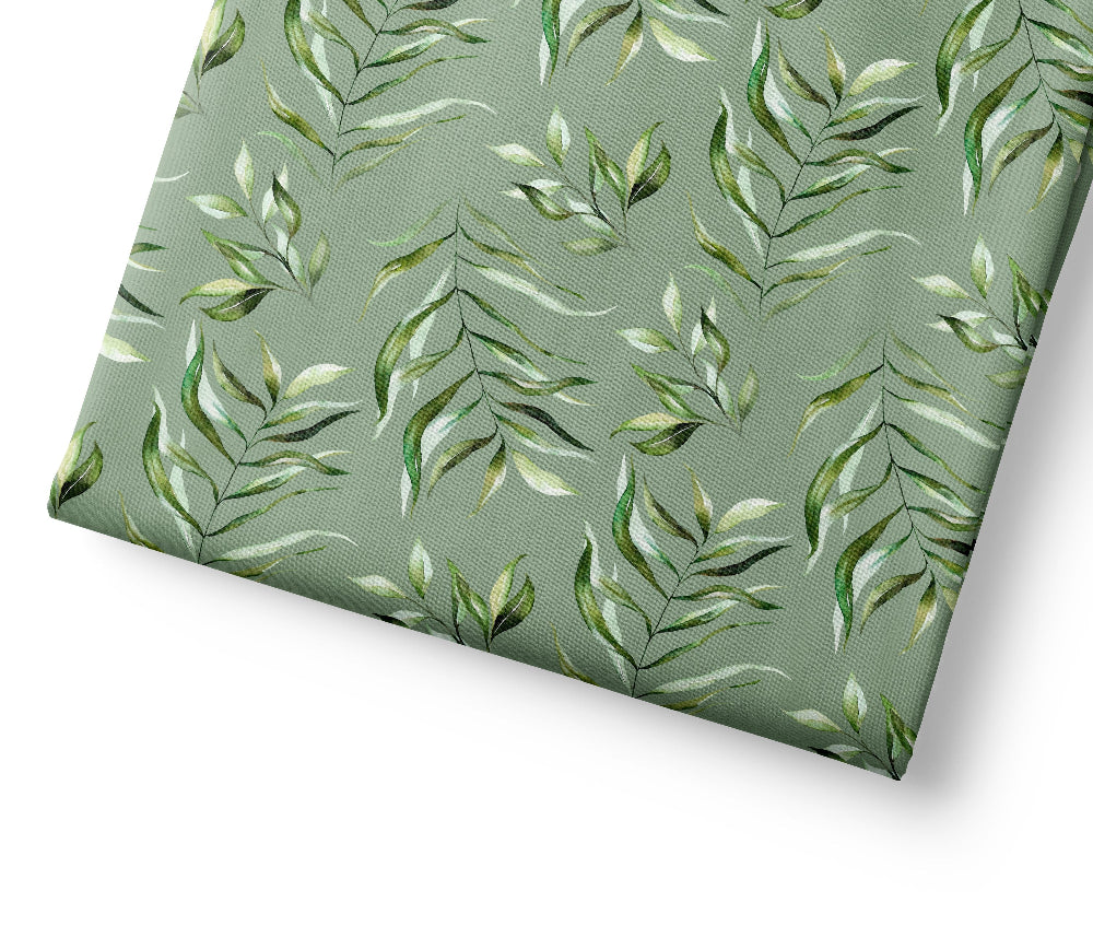 Green leaf patterned fabric on a white background