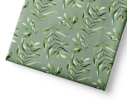 Green leaf patterned fabric on a white background