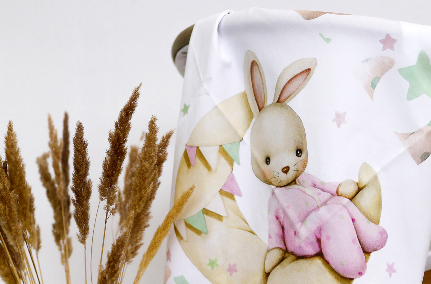 Cotton fabric with cute bunny in pink pijama sitting on the yellow moon