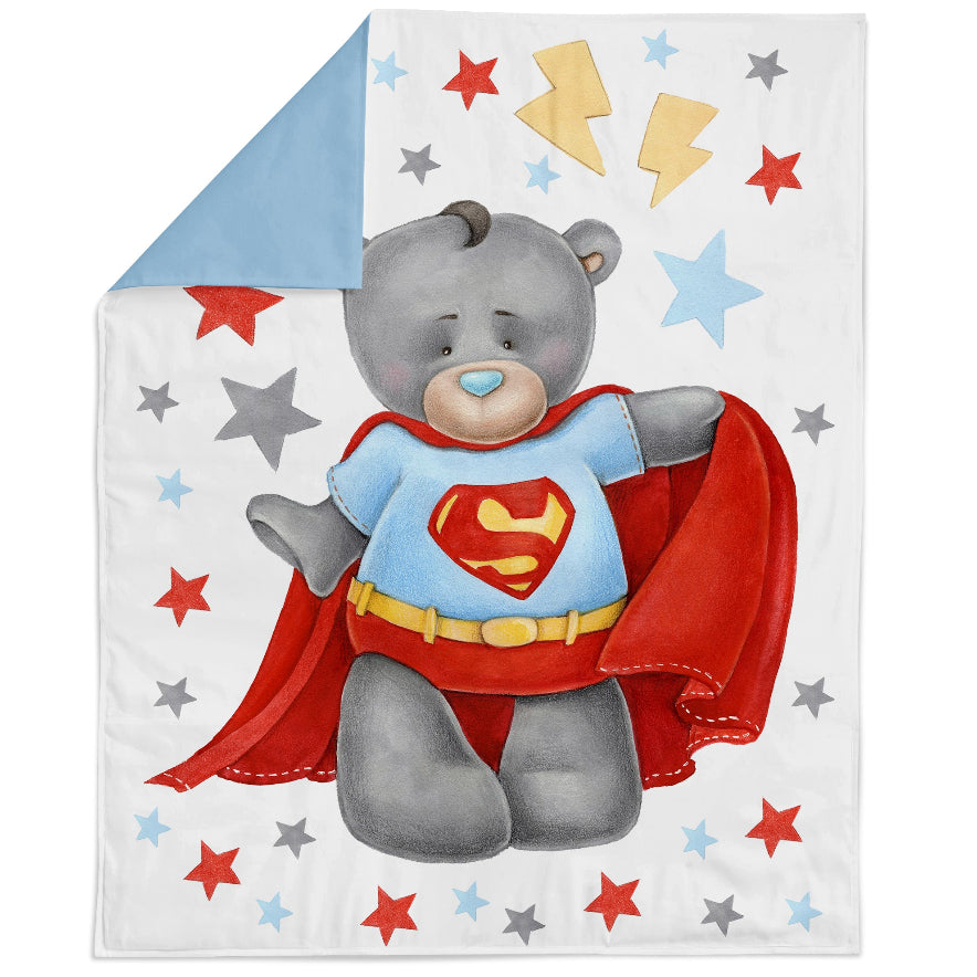 A fabric panel featuring a cartoon bear in a superhero costume with the letter 'S' on his chest, surrounded by a pattern of stars and geometric shapes.