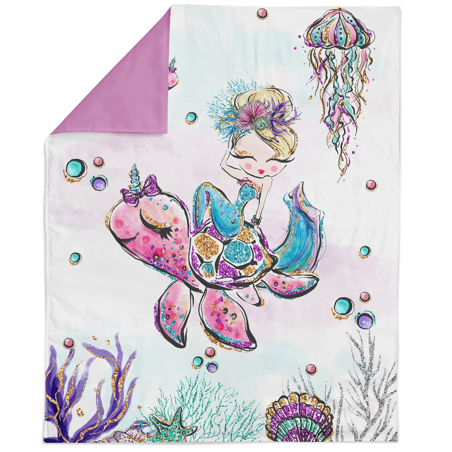 A fabric panel featuring a colorful mermaid design, intended for quilting and sewing projects.
