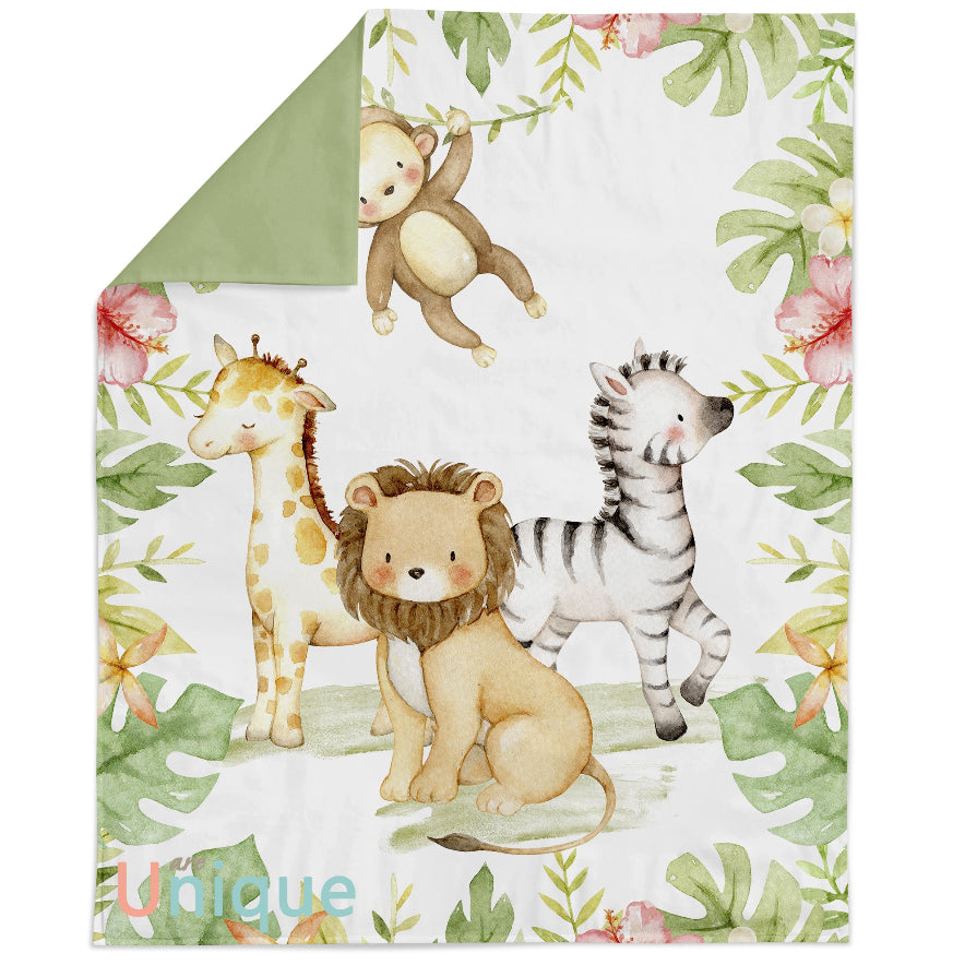 Children's blanket with jungle animals and floral patterns, featuring a lion, zebra, giraffe, and monkey.