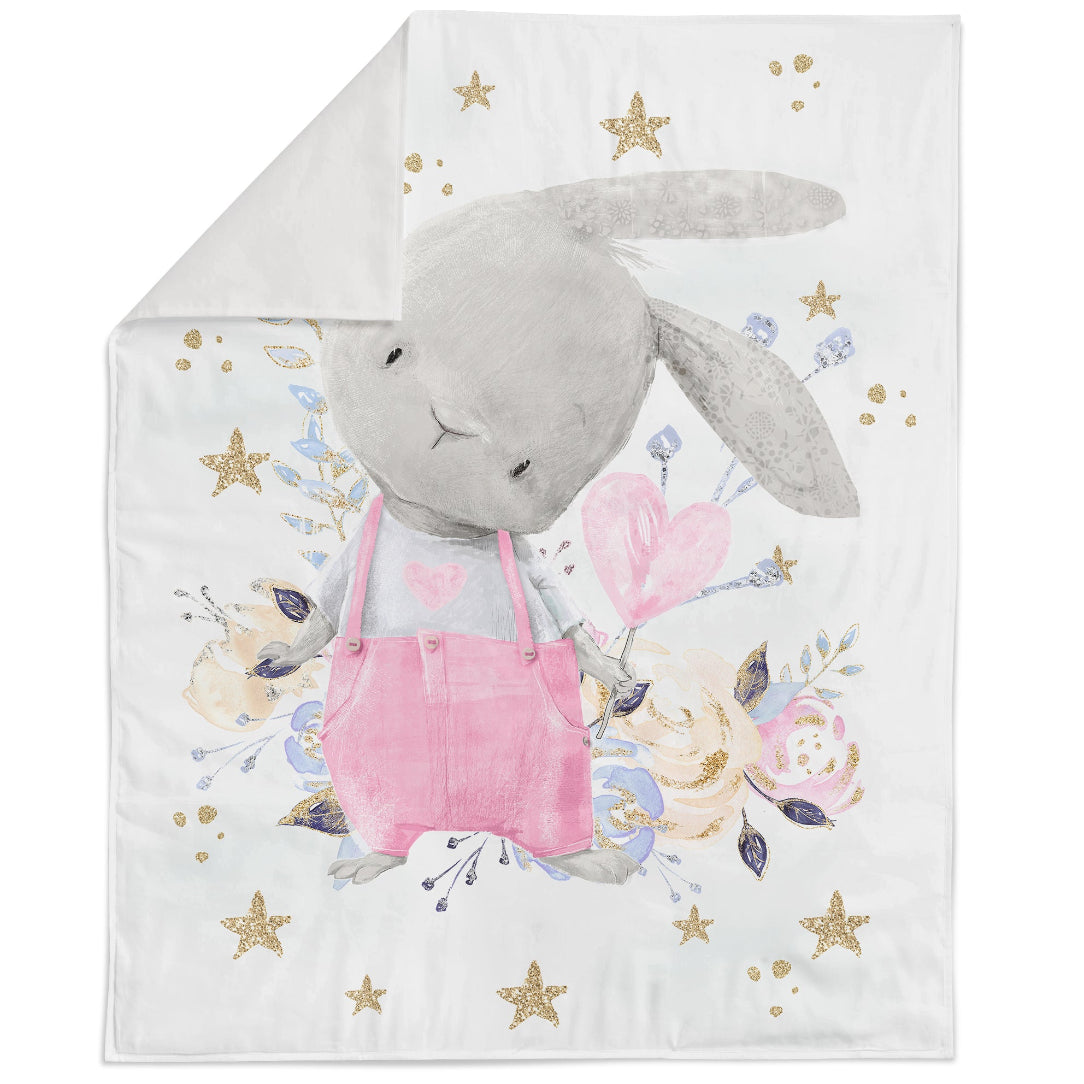 A fabric panel featuring a cute pink bunny design with floral elements and stars, on a white background.
