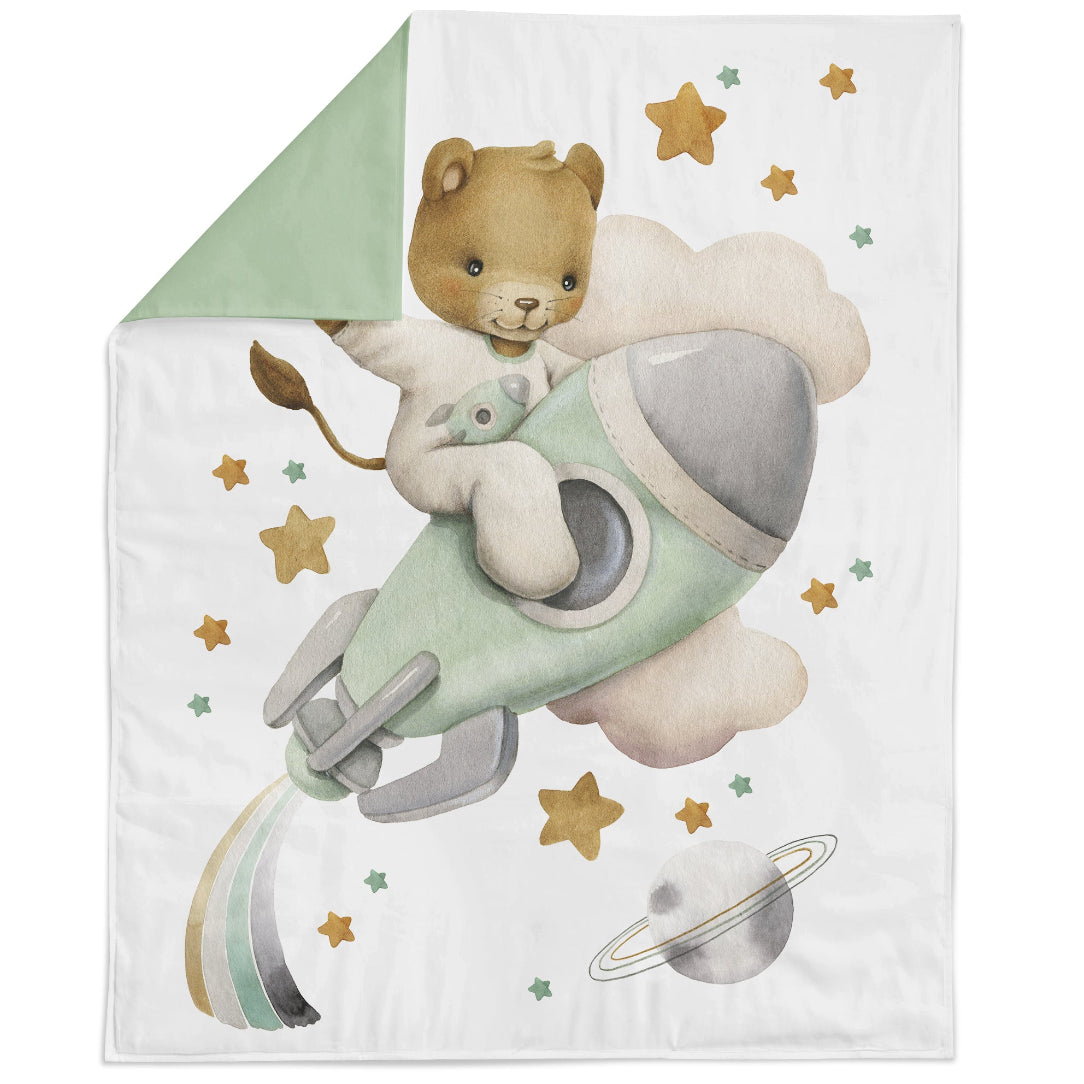 Fabric panel featuring a cartoon space-themed design with a lion in a space suit riding a rocket, surrounded by stars and a planet.