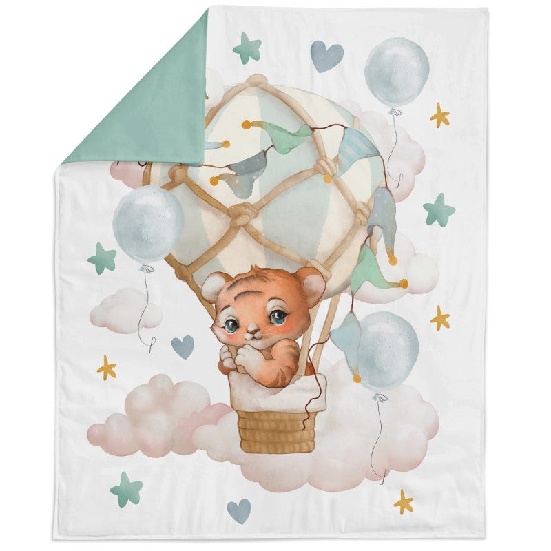 A fabric panel featuring a cartoon bear in a hot air balloon with the text 'My little world' and decorative elements like stars and clouds.