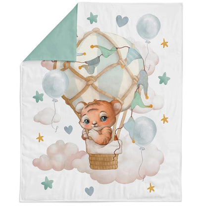A fabric panel featuring a cartoon bear in a hot air balloon with the text 'My little world' and decorative elements like stars and clouds.