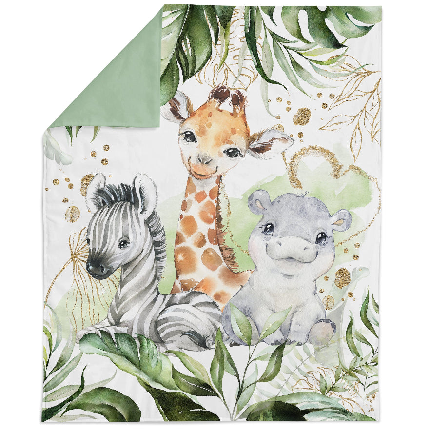 A fabric panel featuring illustrations of a giraffe, zebra, and hippopotamus surrounded by green foliage, intended for quilting and crafting purposes.