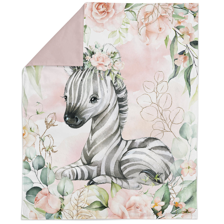 A fabric panel featuring a printed design with a zebra and floral elements on a pink background.