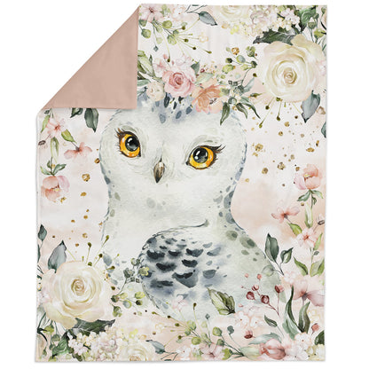 A fabric panel featuring an illustrated owl amidst a floral pattern with various colors such as pink, green, and white.